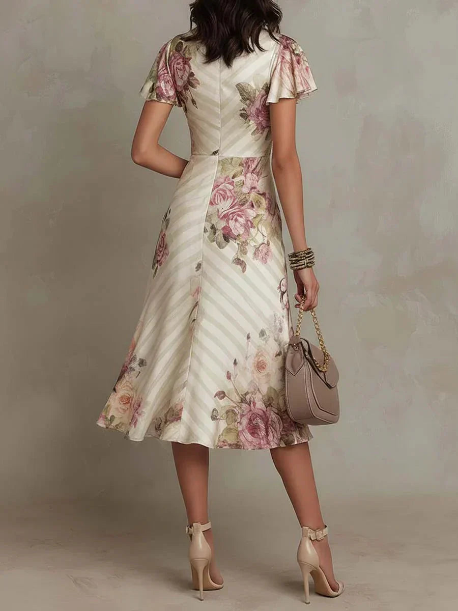 Alba | Vestido midi cruzado fruncido con estampado floral elegante