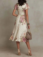 Alba | Vestido midi cruzado fruncido con estampado floral elegante