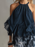 Chloé | Conjunto elegante con top espalda descubierta azul marino y pantalón amplio estampado