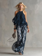Chloé | Conjunto elegante con top espalda descubierta azul marino y pantalón amplio estampado