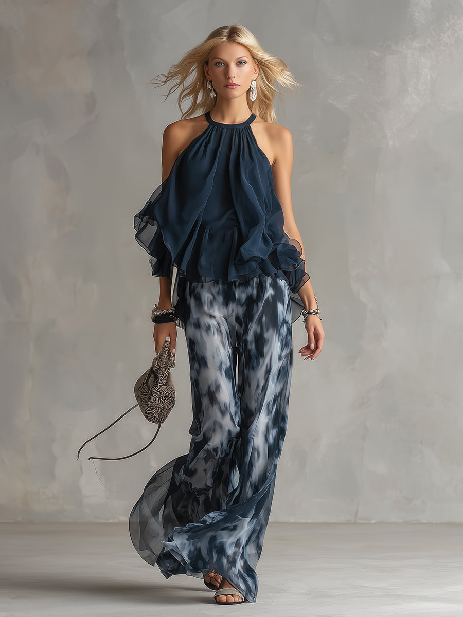 Chloé | Conjunto elegante con top espalda descubierta azul marino y pantalón amplio estampado