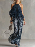 Chloé | Conjunto elegante con top espalda descubierta azul marino y pantalón amplio estampado