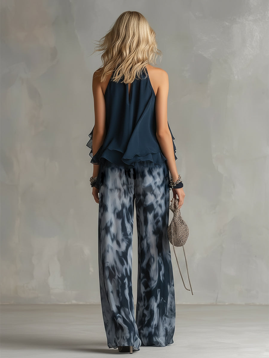 Chloé | Conjunto elegante con top espalda descubierta azul marino y pantalón amplio estampado