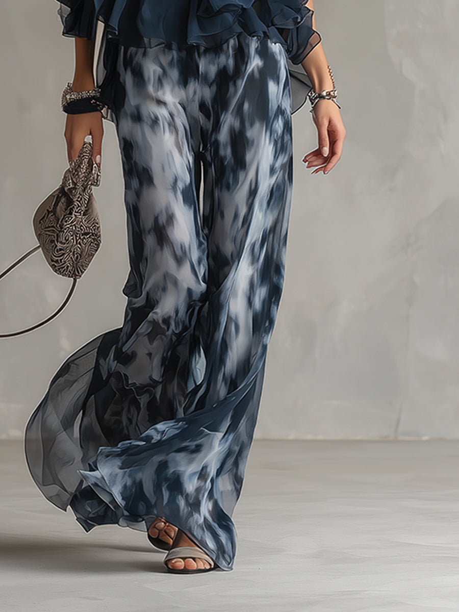 Chloé | Conjunto elegante con top espalda descubierta azul marino y pantalón amplio estampado